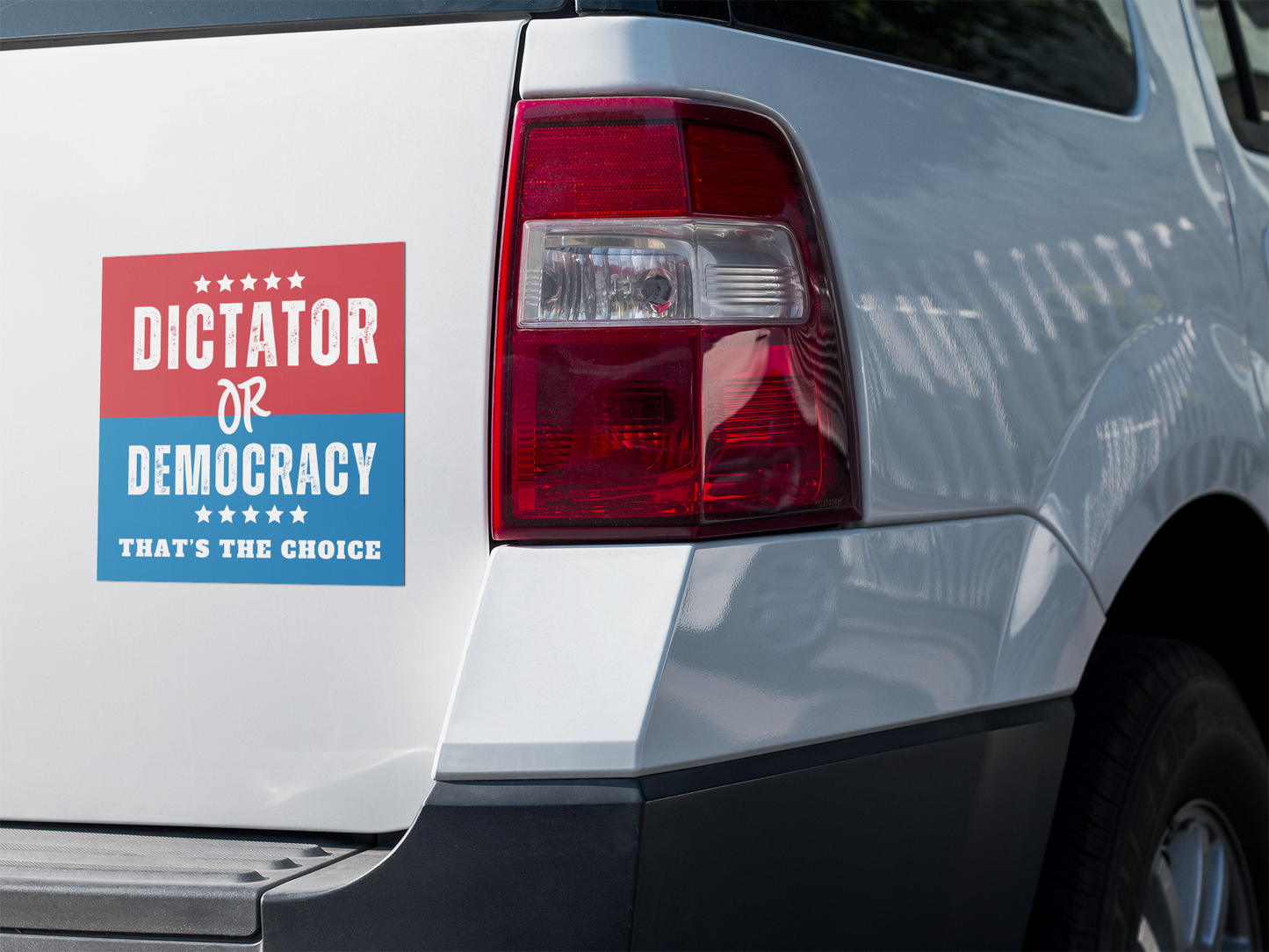 dictator or democracy sticker on white truck